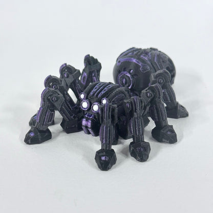 Cyber Spider photographed from a front three-quarter angle, showing its articulated legs and purple detailing on the black body.