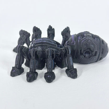 Cyber Spider shown from the side, with its articulated legs, rounded body and purple detailing visible against a light background.