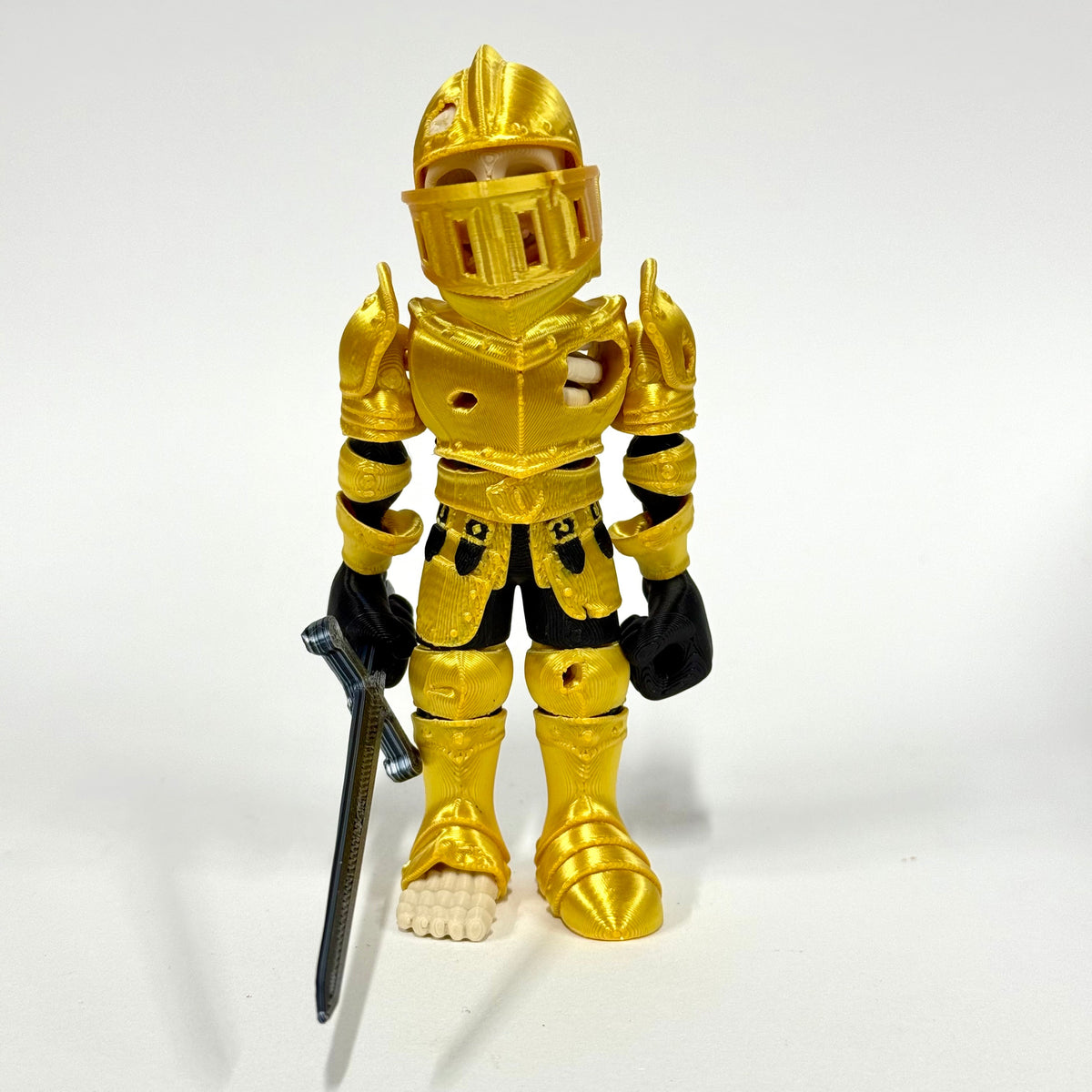 Skeleton Knight 3D printed figure shown in hand for scale – Iubi Design 3D